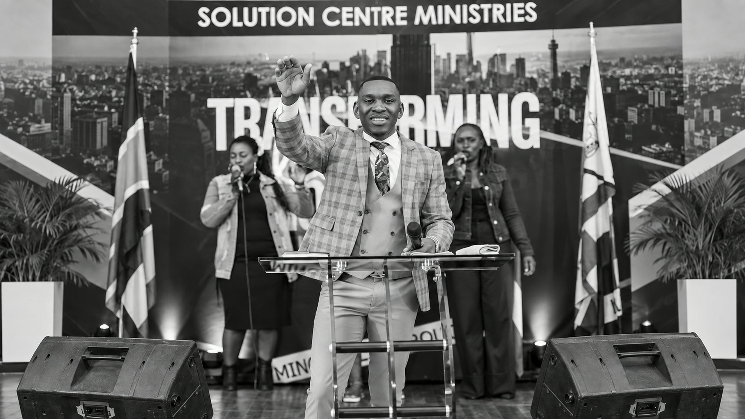 Prophet Elijah, founder of Solution Centre, greeting the congregation from the pulpit